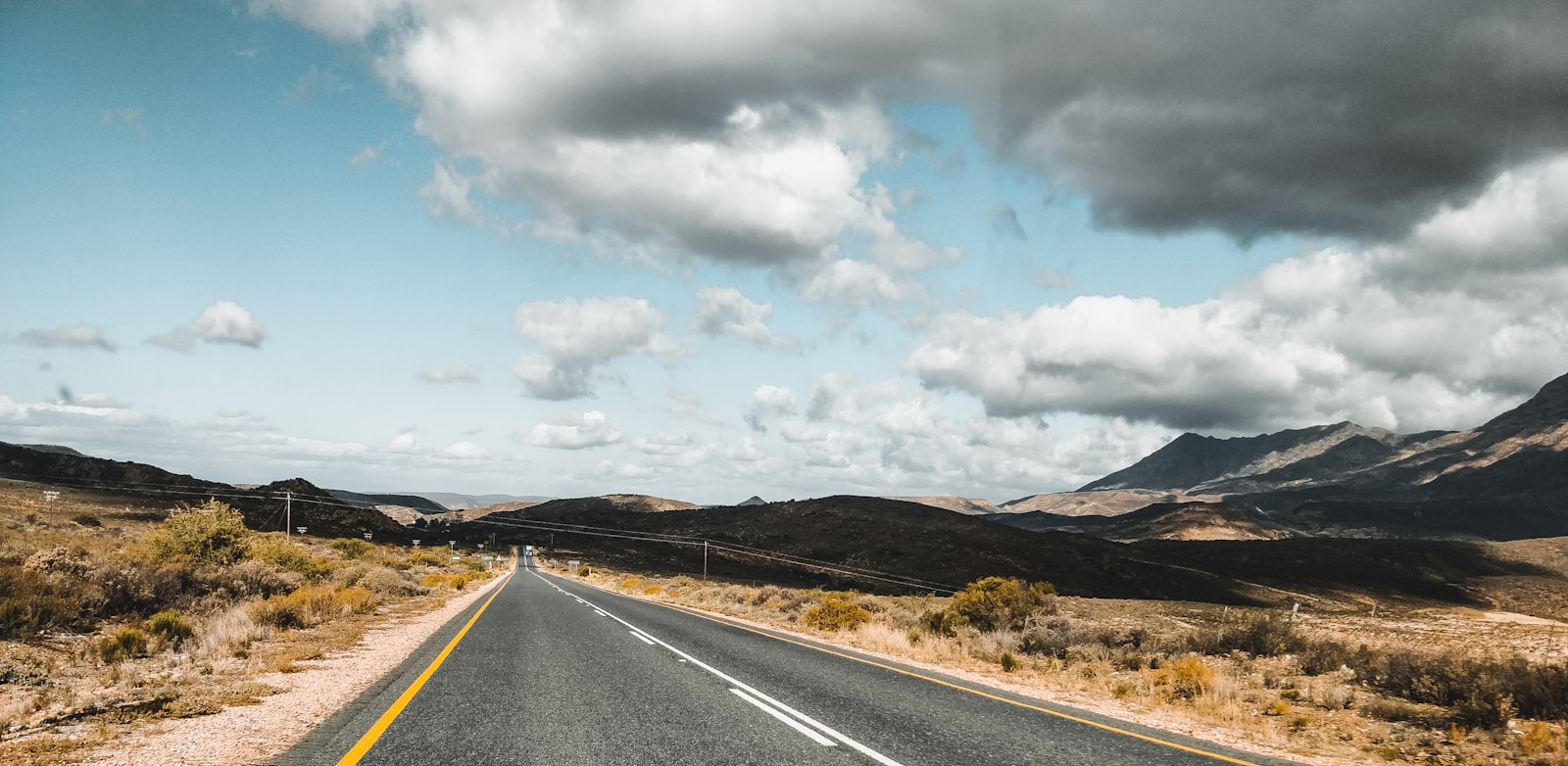Karoo desert gravel road under a wide South African sky